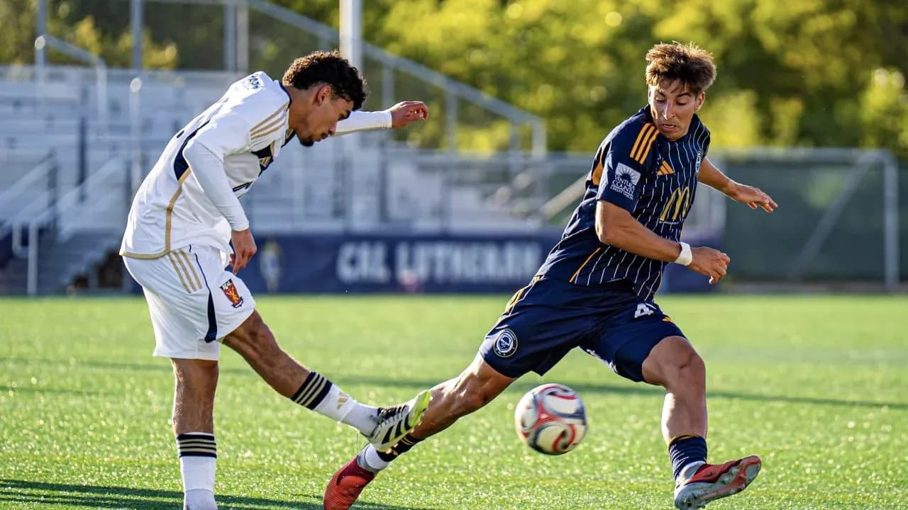 Player tackling opponent during MLS Next Pro match Player tackling opponent during MLS Next Pro match