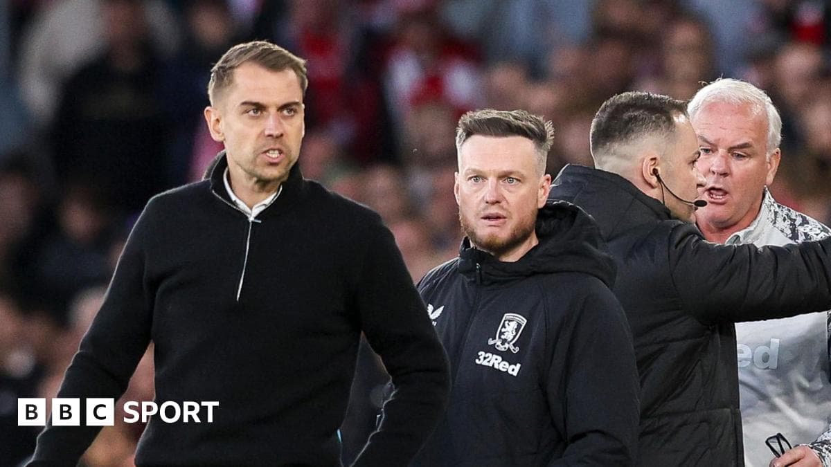 Coaches interacting on the sideline during match Coaches interacting on the sideline during match