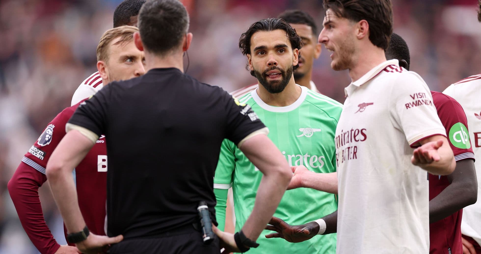Players and referee discussing during a match Players and referee discussing during a match