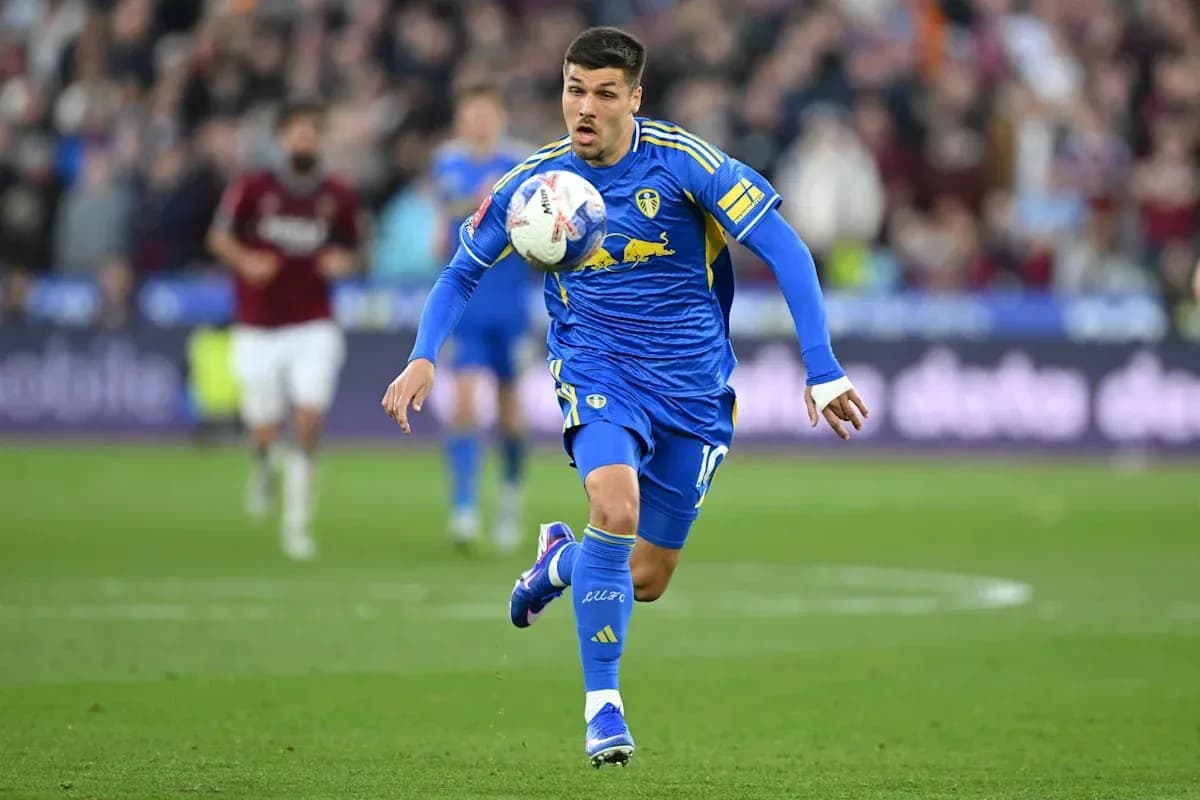 Player in blue kit dribbling the ball during match Player in blue kit dribbling the ball during match