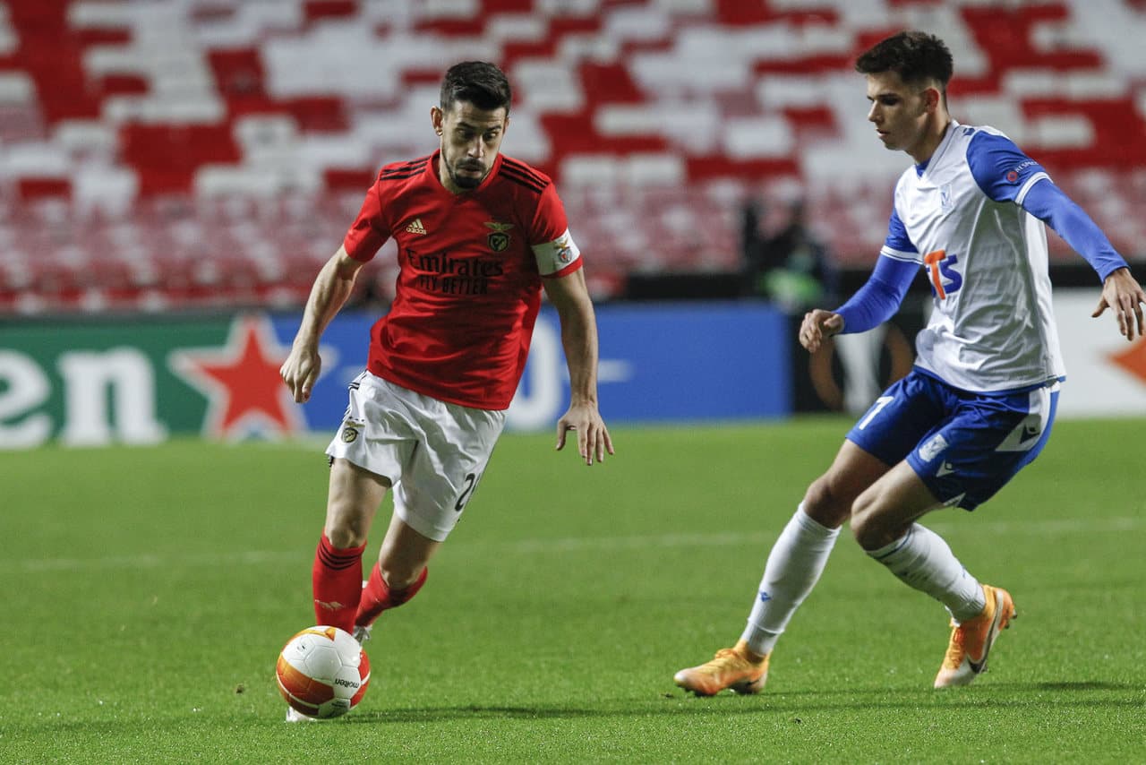 Benfica player dribbling during Europa League match Benfica player dribbling during Europa League match