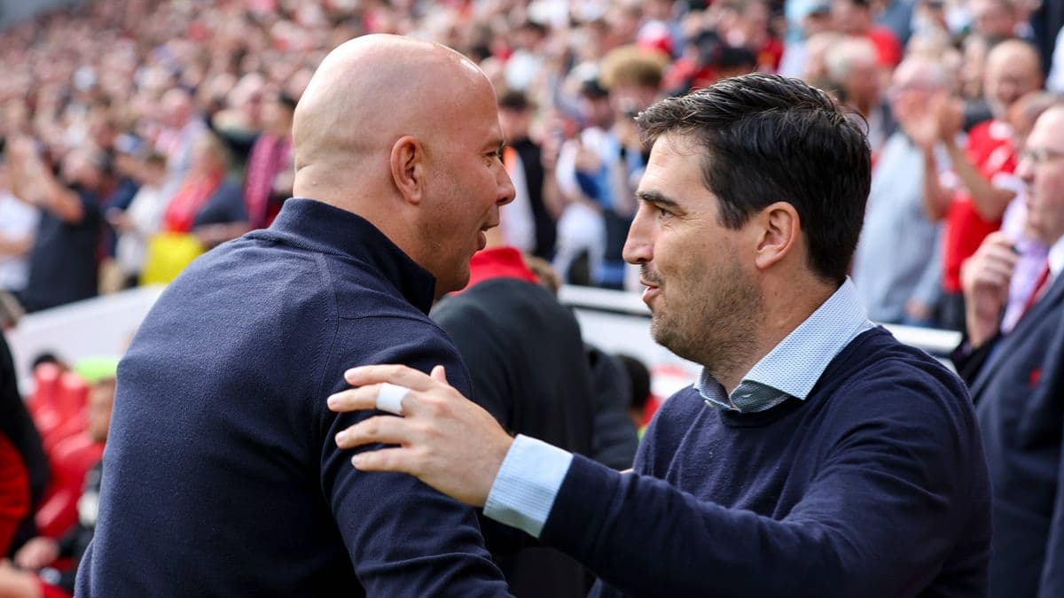 Two coaches greeting each other before a match Two coaches greeting each other before a match