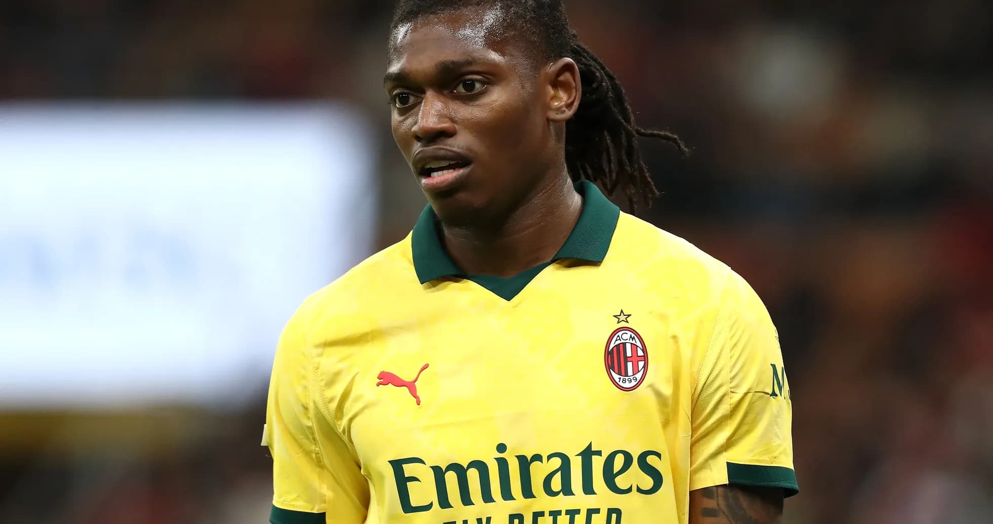 AC Milan player in yellow jersey during match AC Milan player in yellow jersey during match