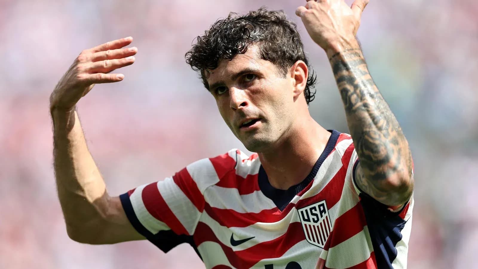 Player gesturing during match, wearing USA jersey Player gesturing during match, wearing USA jersey