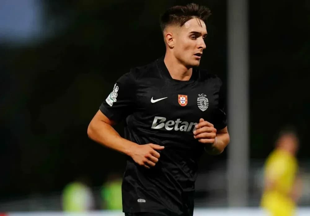 Player in black jersey running on field Player in black jersey running on field