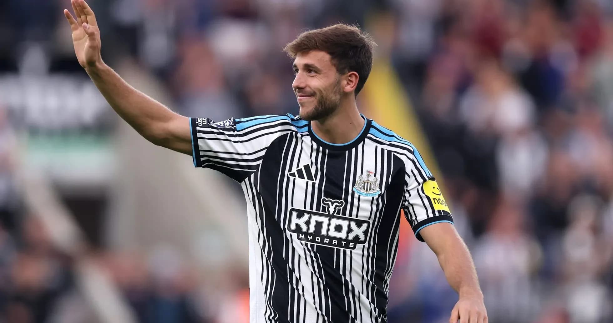 Newcastle player waving to the crowd during match Newcastle player waving to the crowd during match