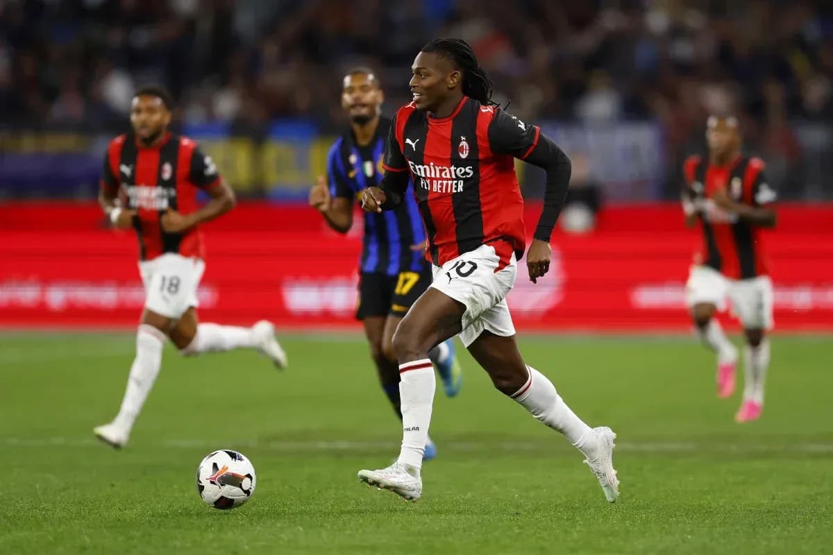AC Milan player running with the ball during match AC Milan player running with the ball during match