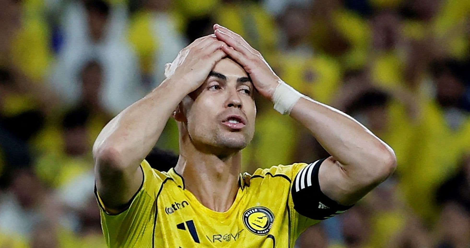Player holding head in frustration during match Player holding head in frustration during match
