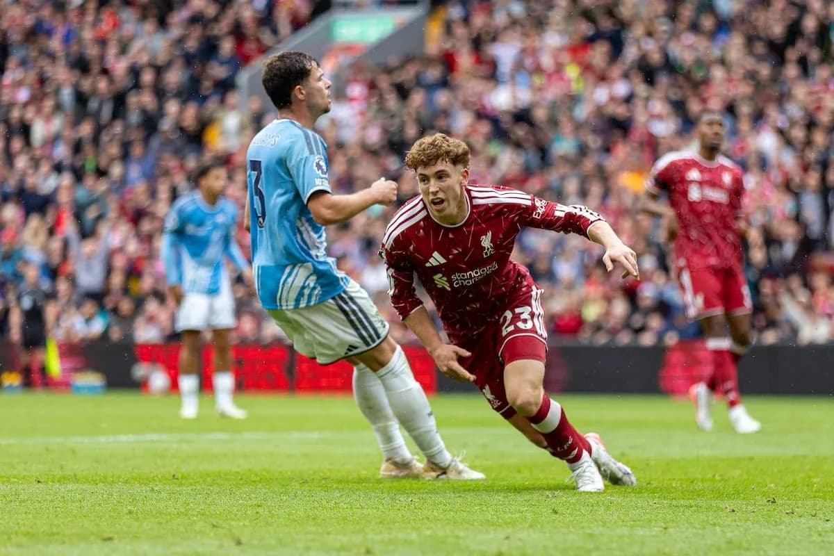 Liverpool player chasing the ball against Nottingham Liverpool player chasing the ball against Nottingham