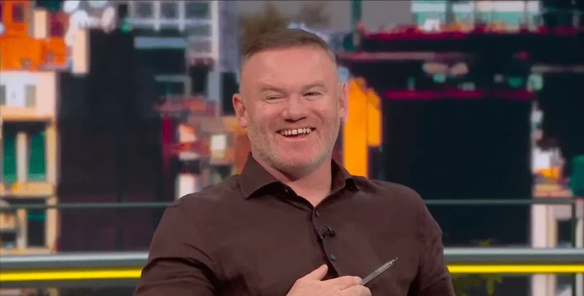 Sports analyst smiling during a television broadcast Sports analyst smiling during a television broadcast