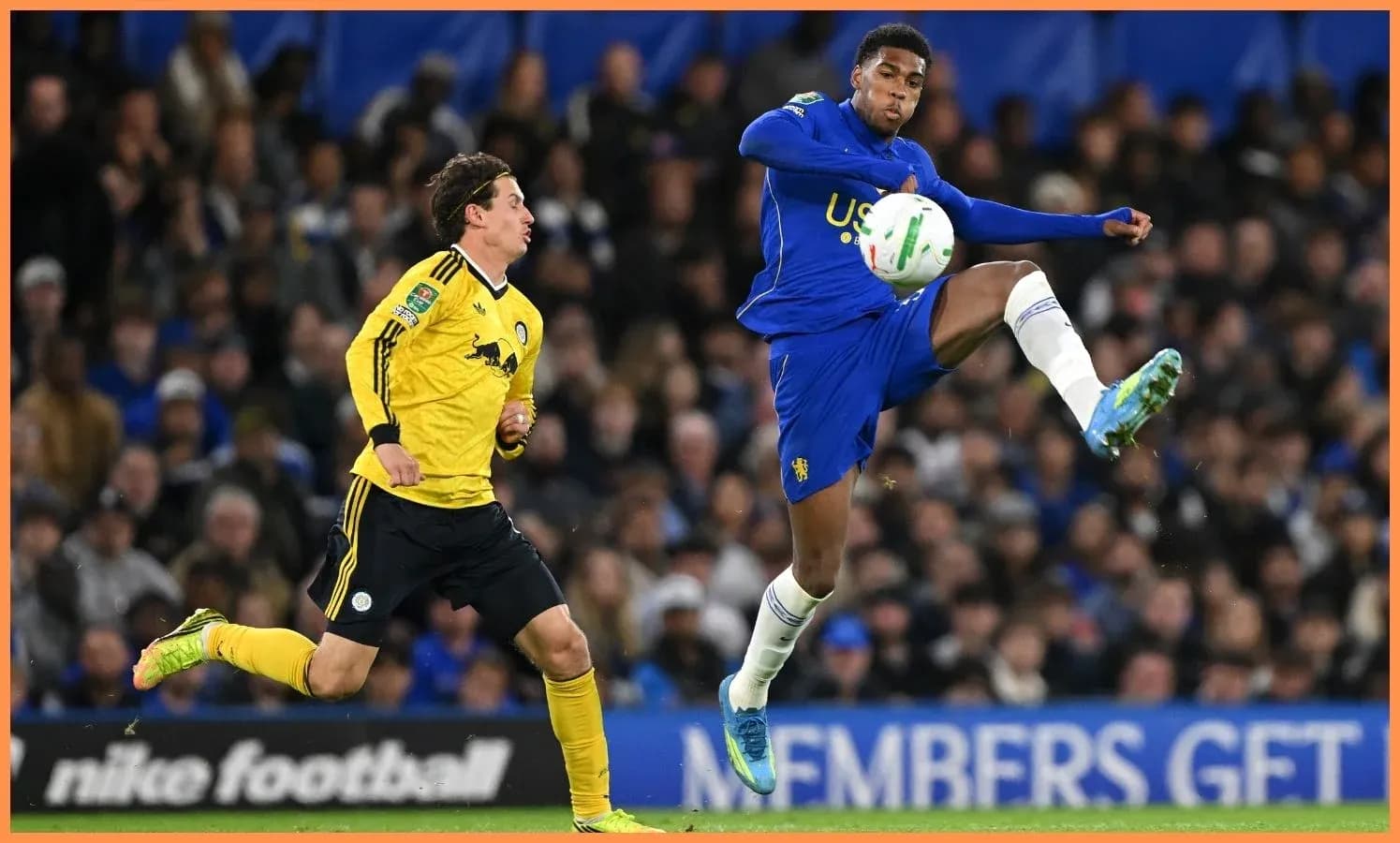 Player kicking ball while opponent defends during match Player kicking ball while opponent defends during match