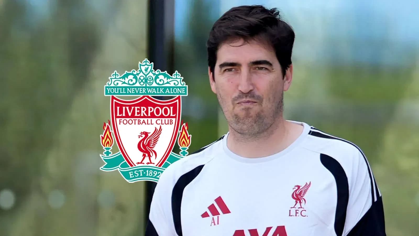 Coach in Liverpool FC training gear with club logo Coach in Liverpool FC training gear with club logo