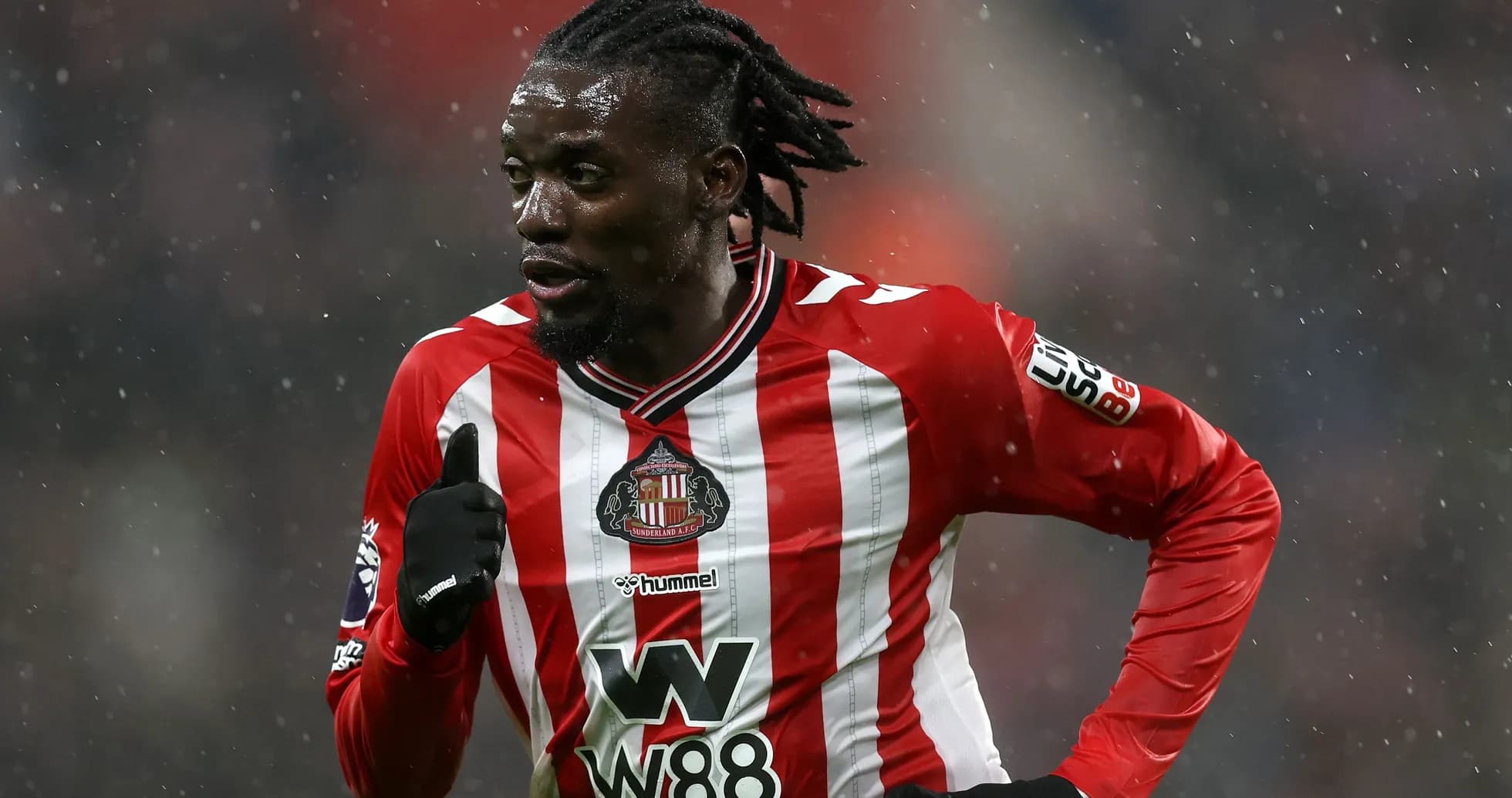 Player running in Sunderland FC kit during match Player running in Sunderland FC kit during match