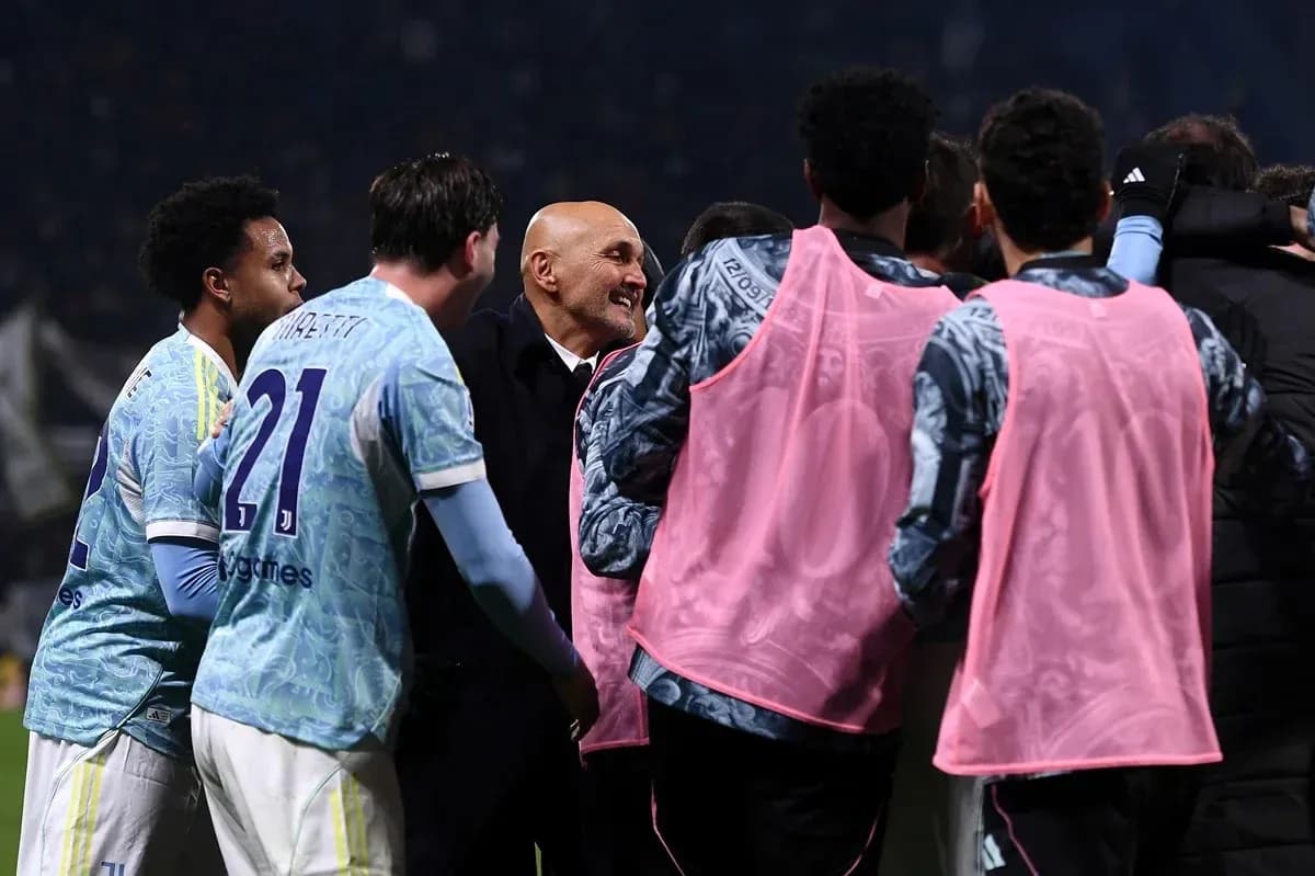 Players celebrating with coach after match victory Players celebrating with coach after match victory