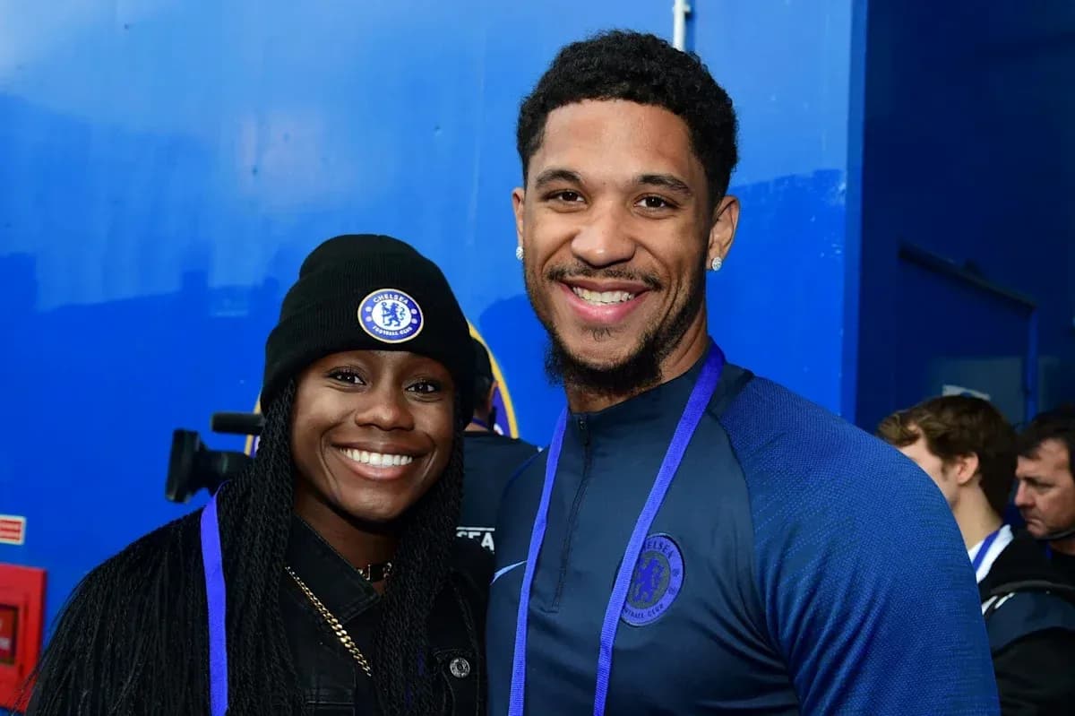 Two Chelsea FC fans posing together at event Two Chelsea FC fans posing together at event
