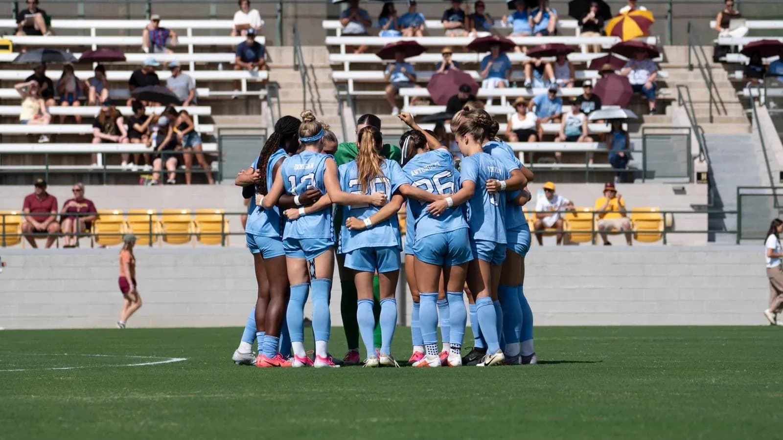 Soccer team huddled together before the match Soccer team huddled together before the match