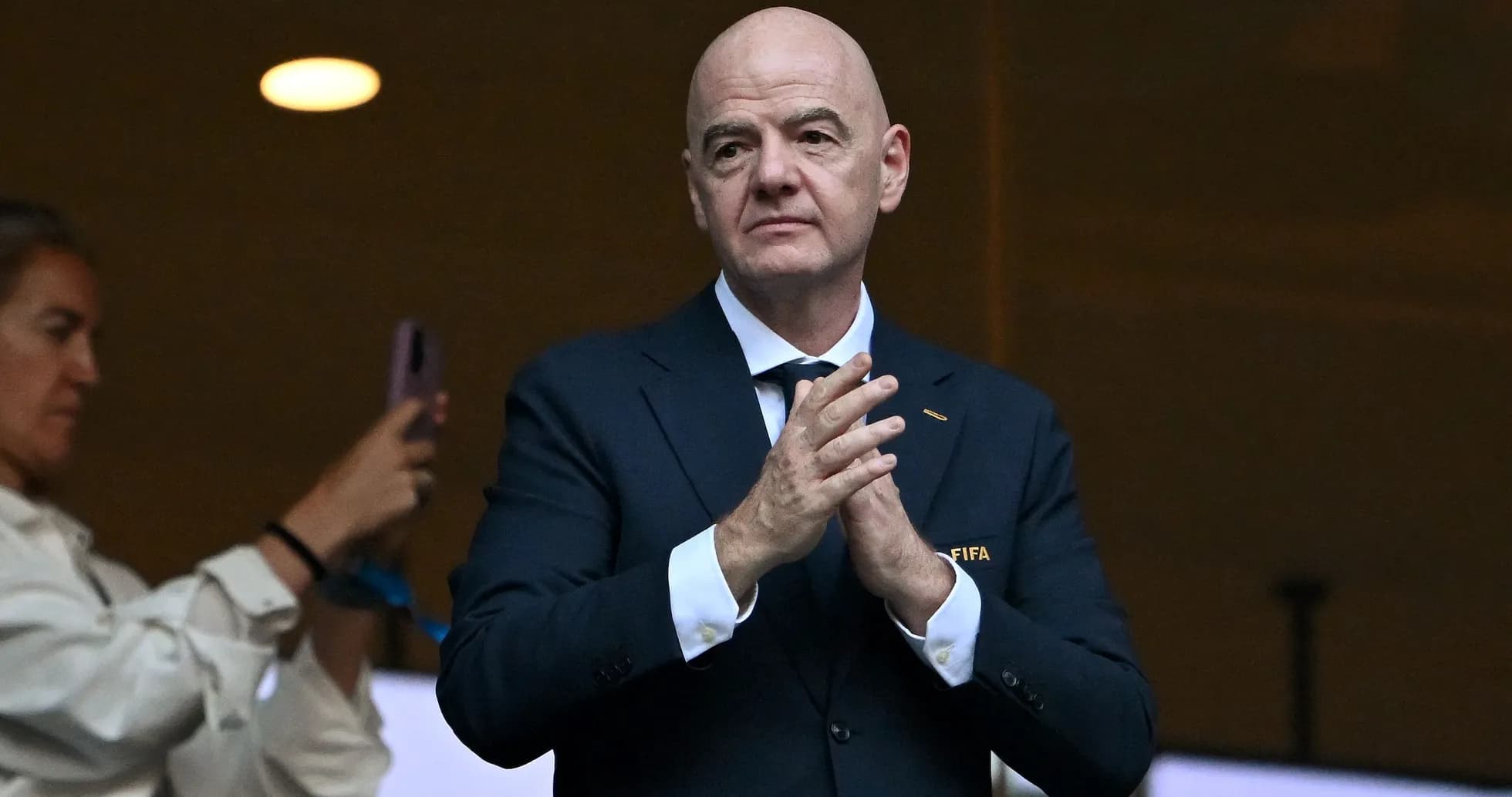 FIFA official applauding during an event FIFA official applauding during an event