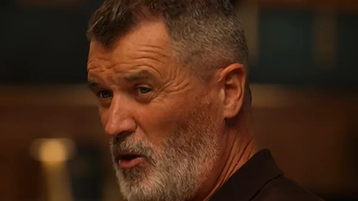Man with a beard speaking in a dimly lit room Man with a beard speaking in a dimly lit room