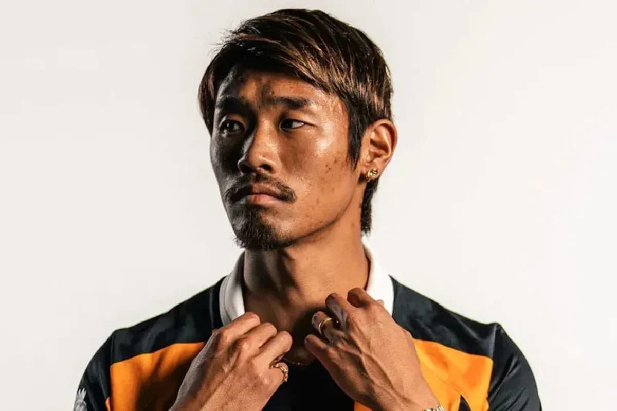 Athlete posing in team jersey with accessories Athlete posing in team jersey with accessories