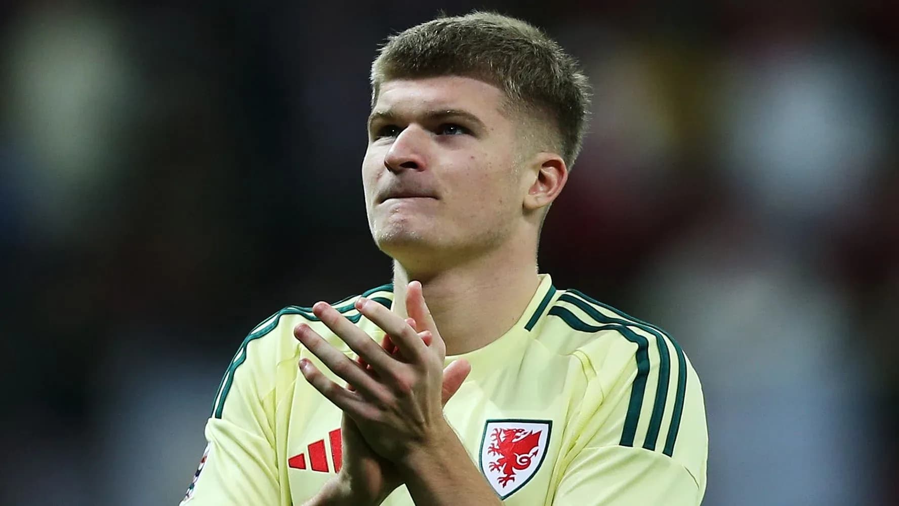 Player applauding in yellow kit after match Player applauding in yellow kit after match