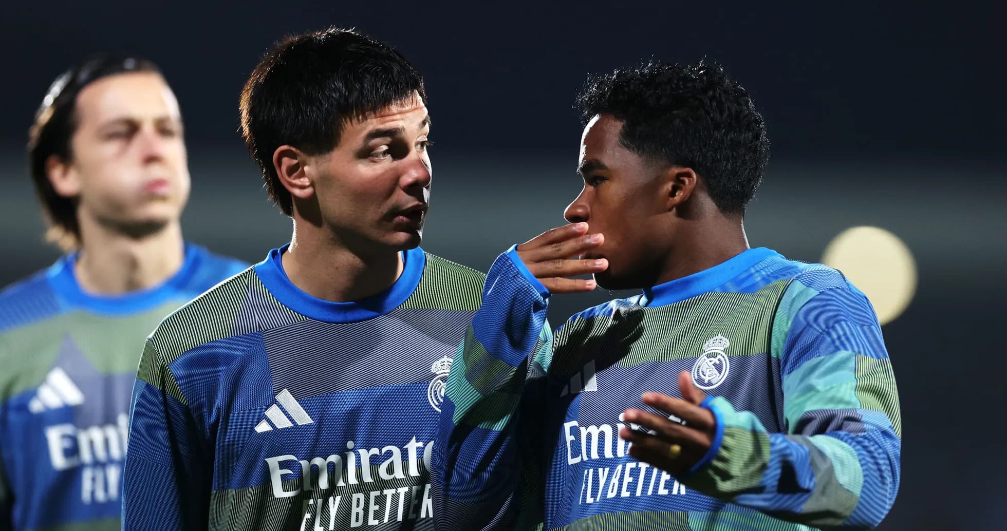 Two players discussing during training session at night Two players discussing during training session at night