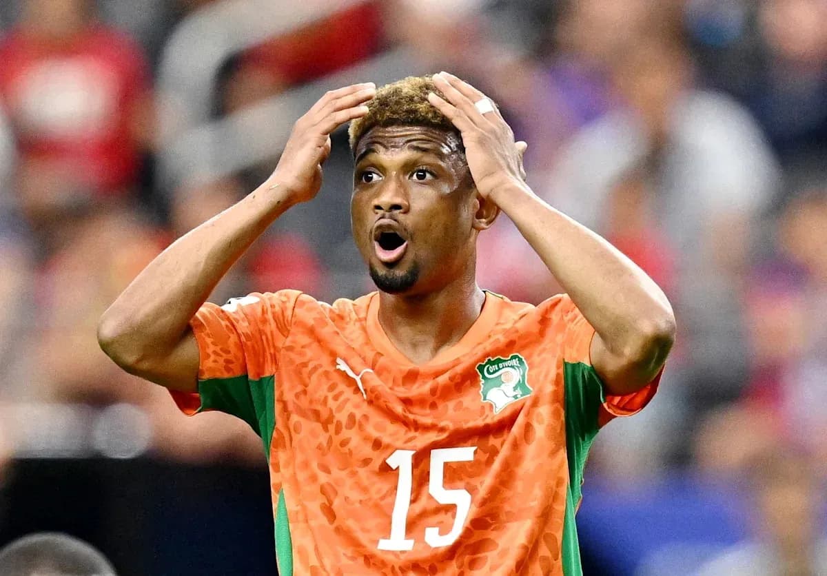 Player in orange jersey reacting during the match Player in orange jersey reacting during the match