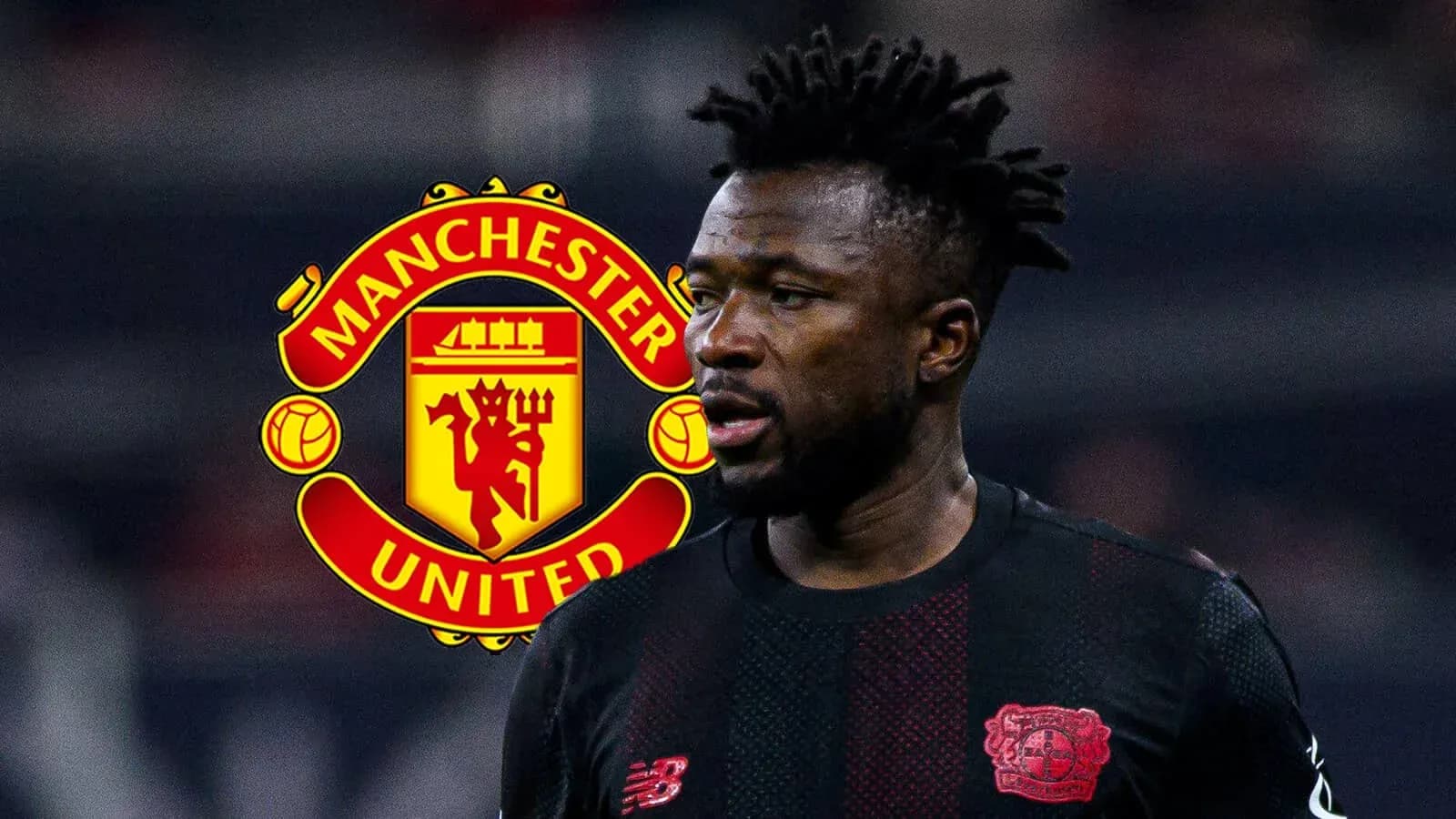 Player in black kit with Manchester United logo behind Player in black kit with Manchester United logo behind