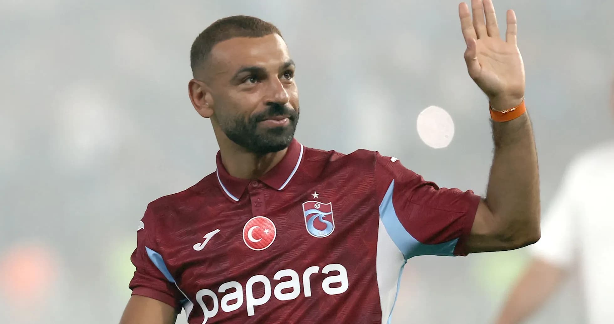 Player waving while wearing Trabzonspor jersey Player waving while wearing Trabzonspor jersey