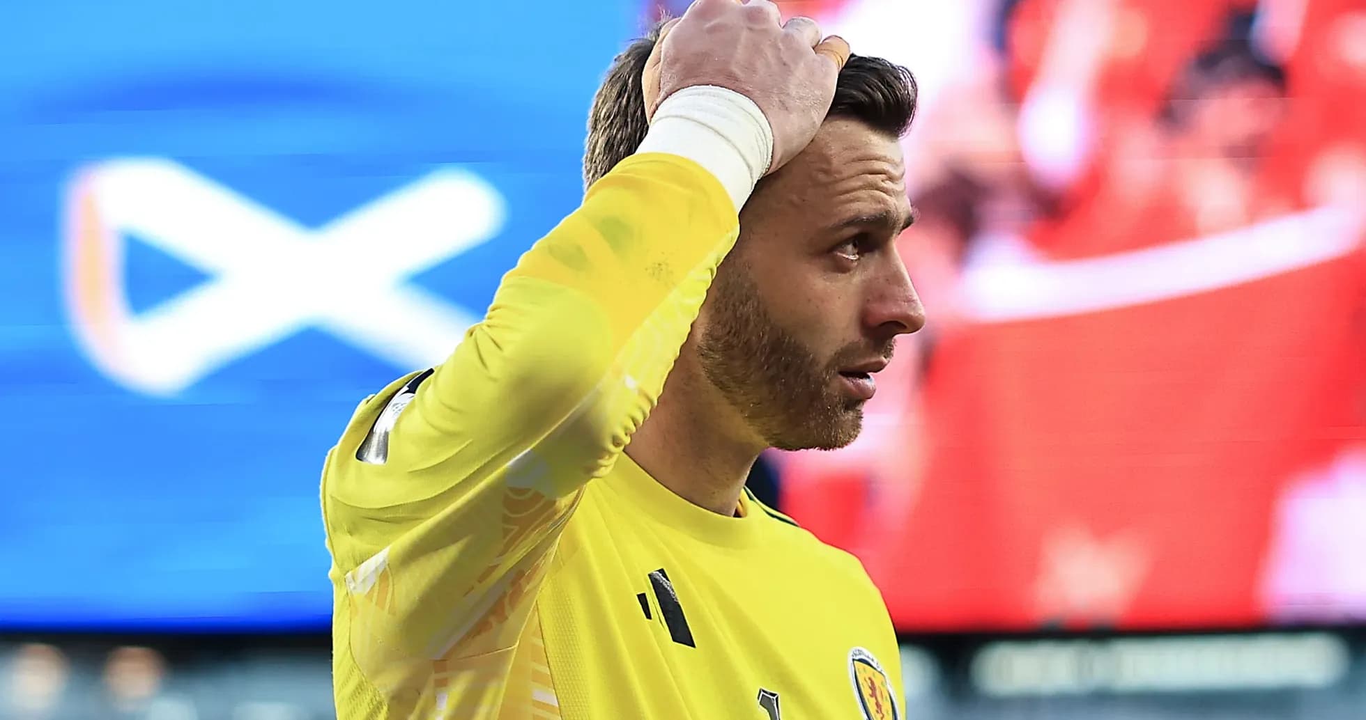 Goalkeeper in yellow jersey during match action Goalkeeper in yellow jersey during match action