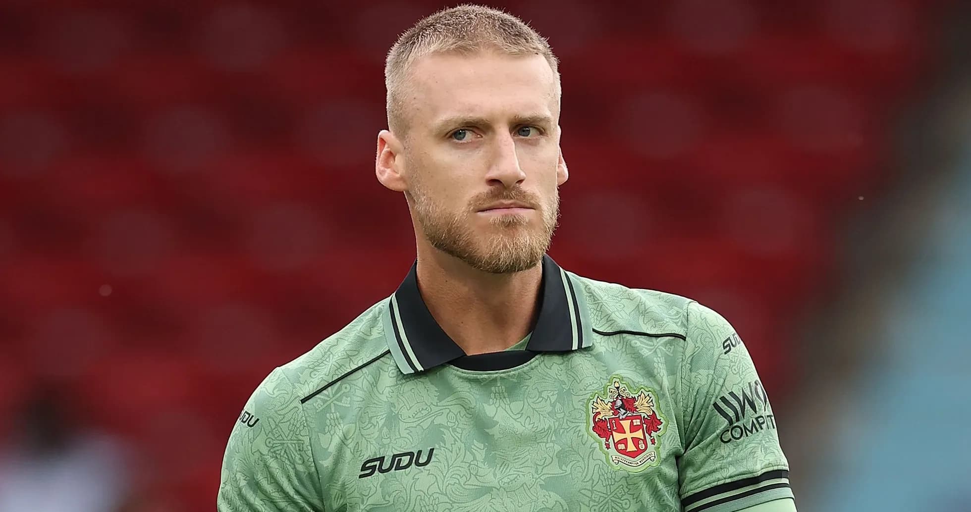 Goalkeeper in green kit during warm-up Goalkeeper in green kit during warm-up