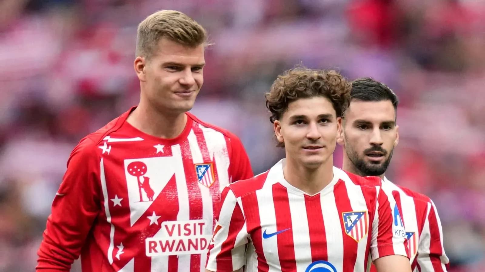 Atletico Madrid players in team warm-up attire Atletico Madrid players in team warm-up attire