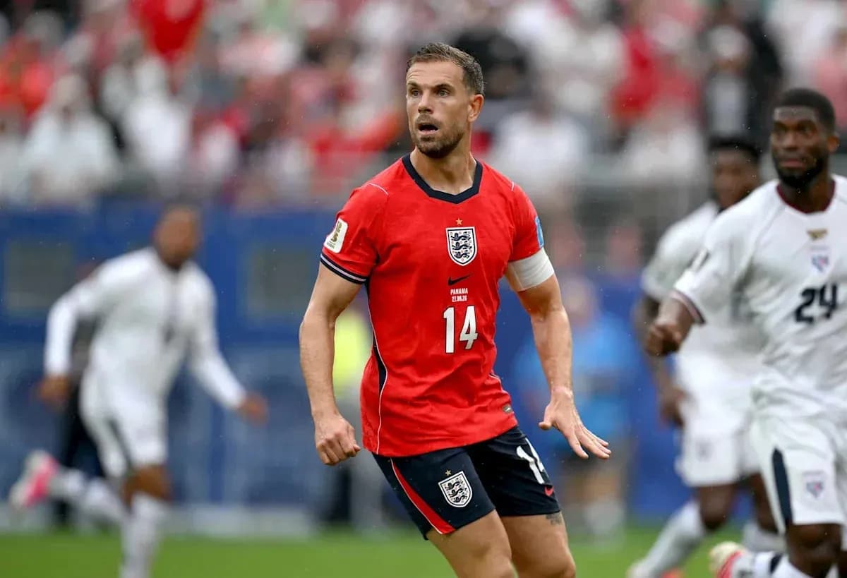 Player in red England jersey during match action Player in red England jersey during match action