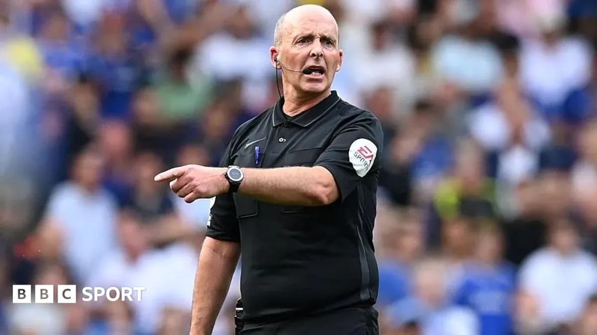 Referee signaling during a football match Referee signaling during a football match