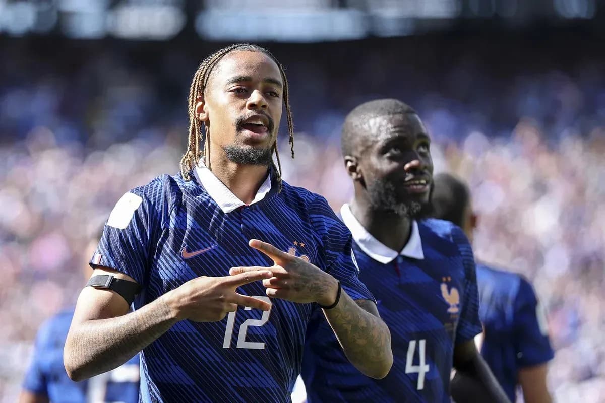 Two French players celebrating on the field Two French players celebrating on the field