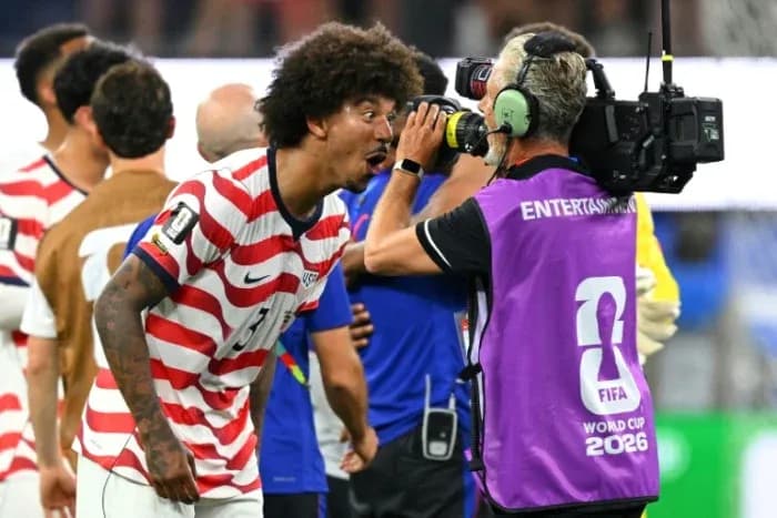 Player celebrating and interacting with cameraman post-match Player celebrating and interacting with cameraman post-match