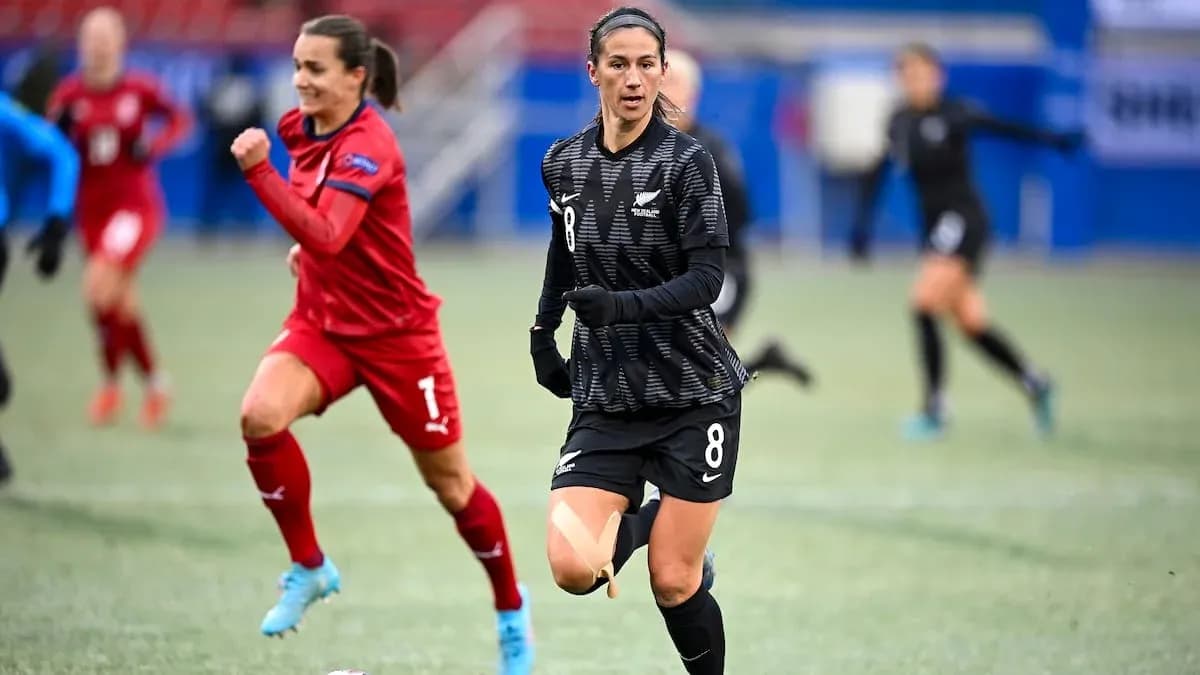 New Zealand player running with ball during match New Zealand player running with ball during match