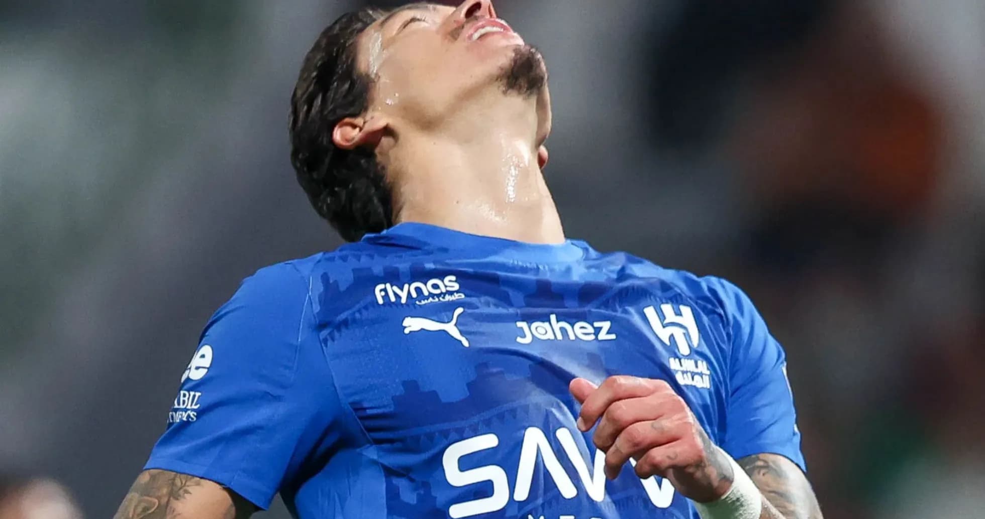Player in blue jersey reacting on the field Player in blue jersey reacting on the field