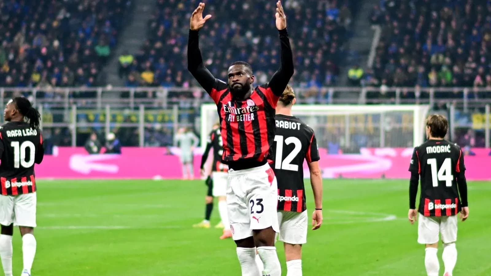 AC Milan players celebrating on the field AC Milan players celebrating on the field