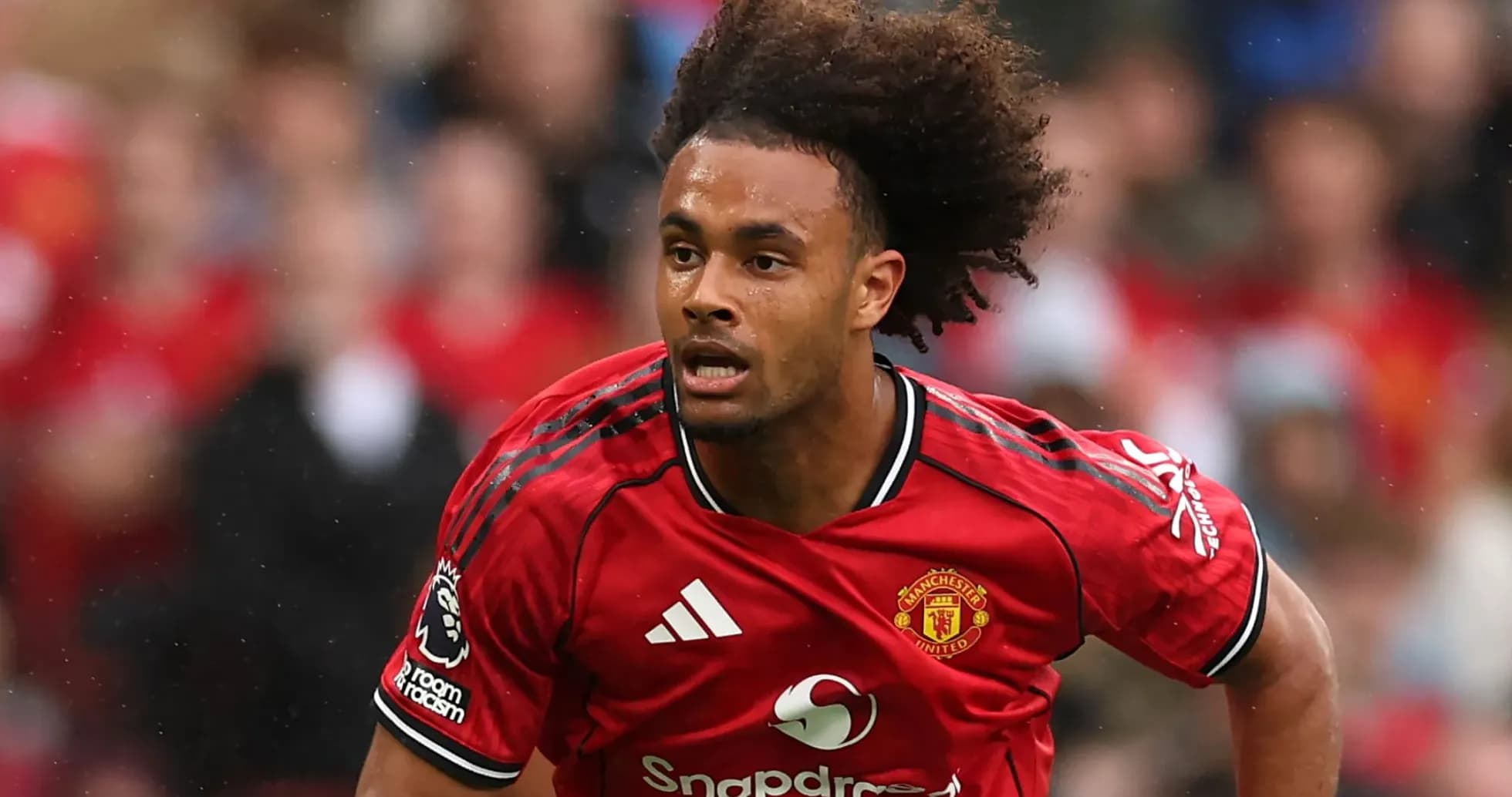 Player running in Manchester United kit during match Player running in Manchester United kit during match