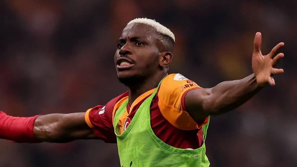 Player celebrating a goal wearing Galatasaray jersey Player celebrating a goal wearing Galatasaray jersey