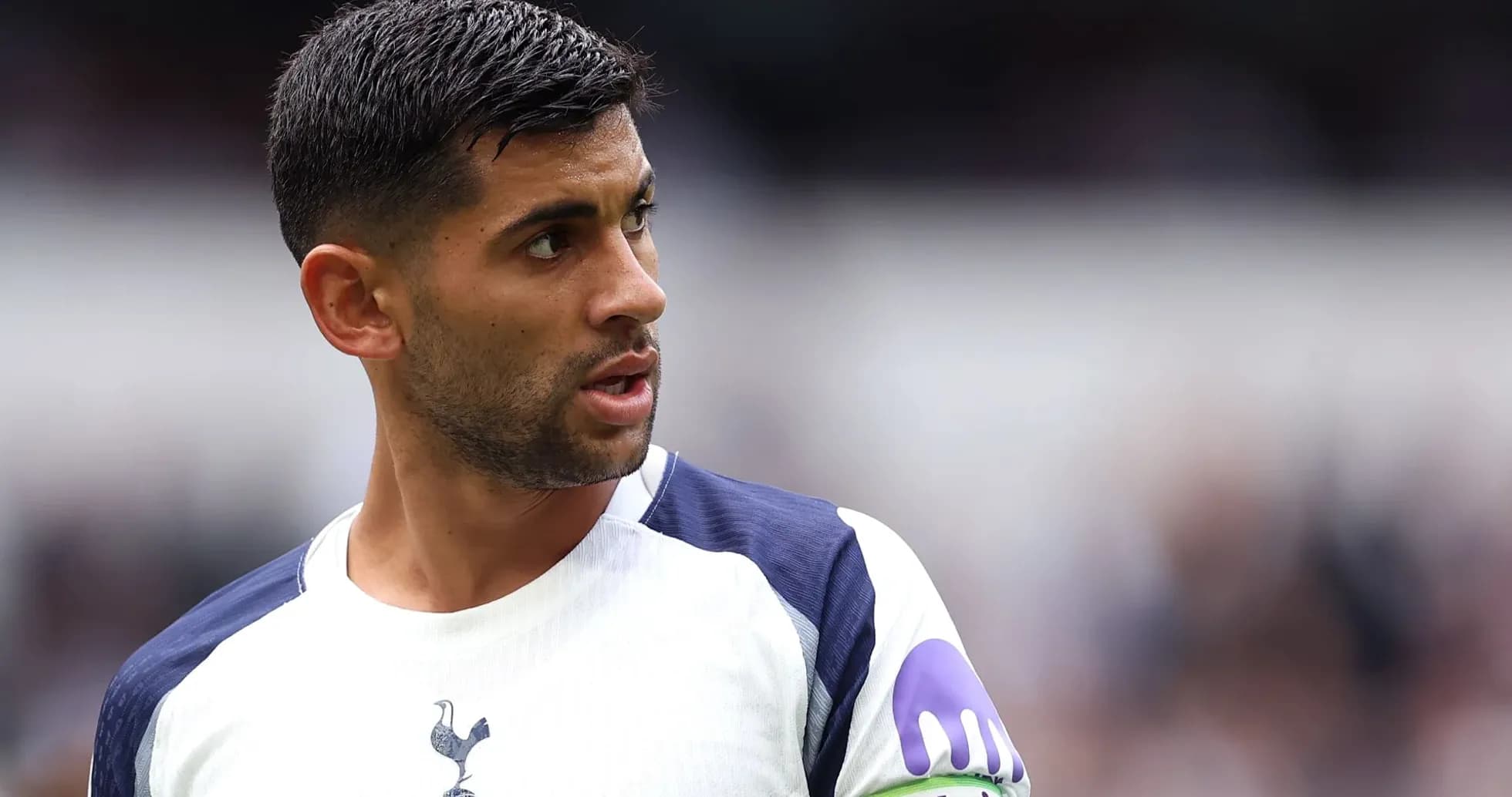 Player in Tottenham kit looking towards the side Player in Tottenham kit looking towards the side