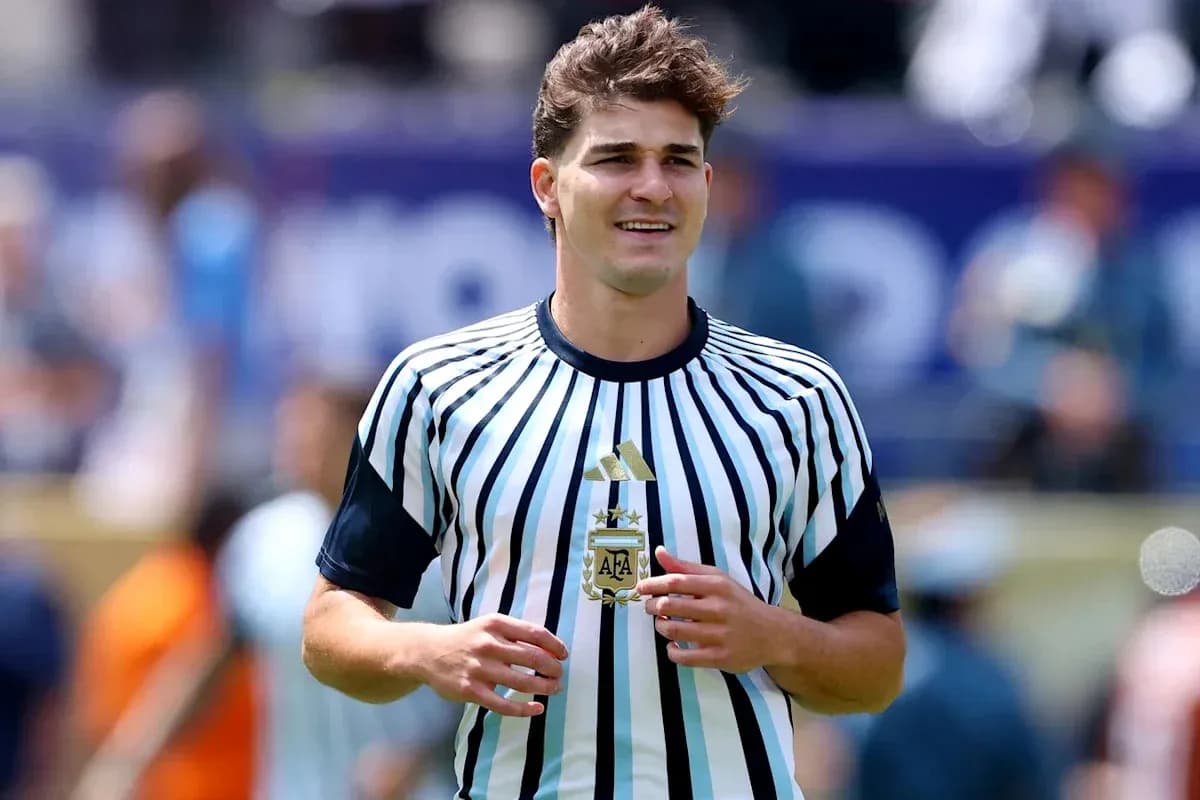 Player in striped jersey holding a trophy Player in striped jersey holding a trophy