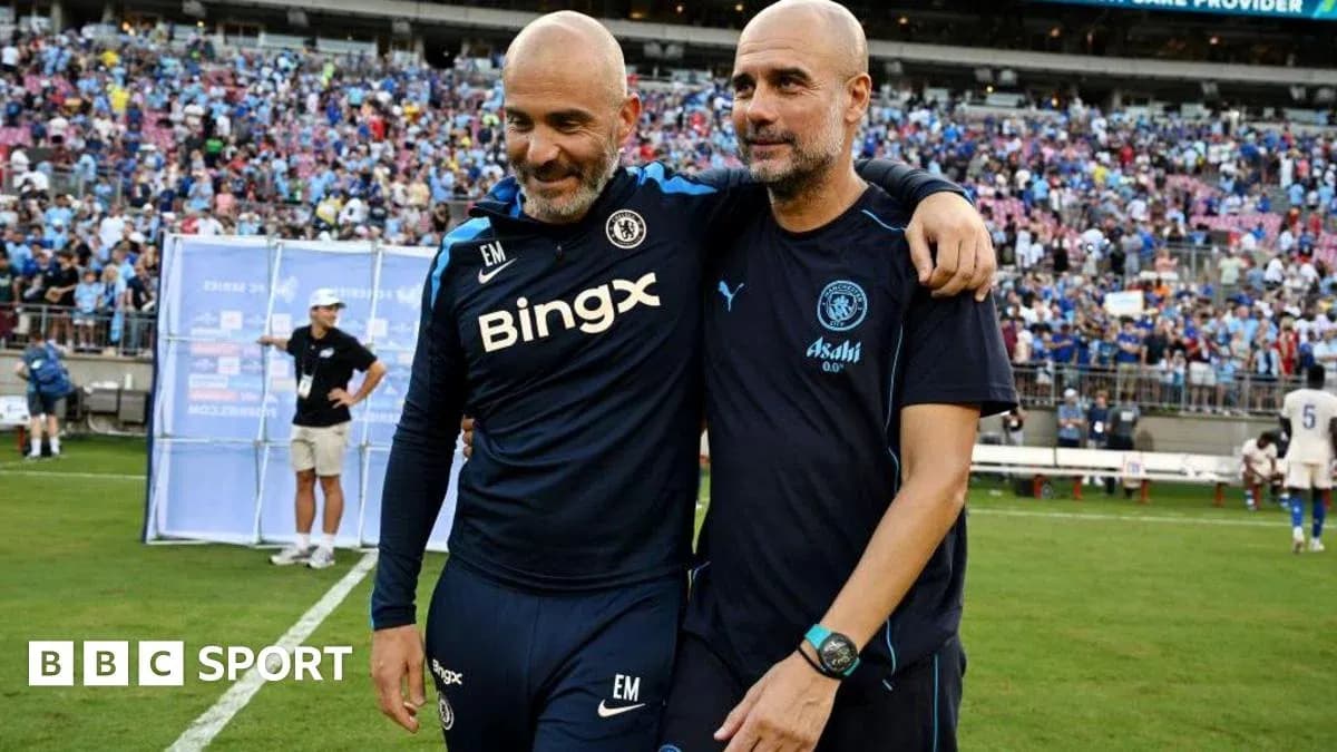 Two coaches walking off the field after match Two coaches walking off the field after match