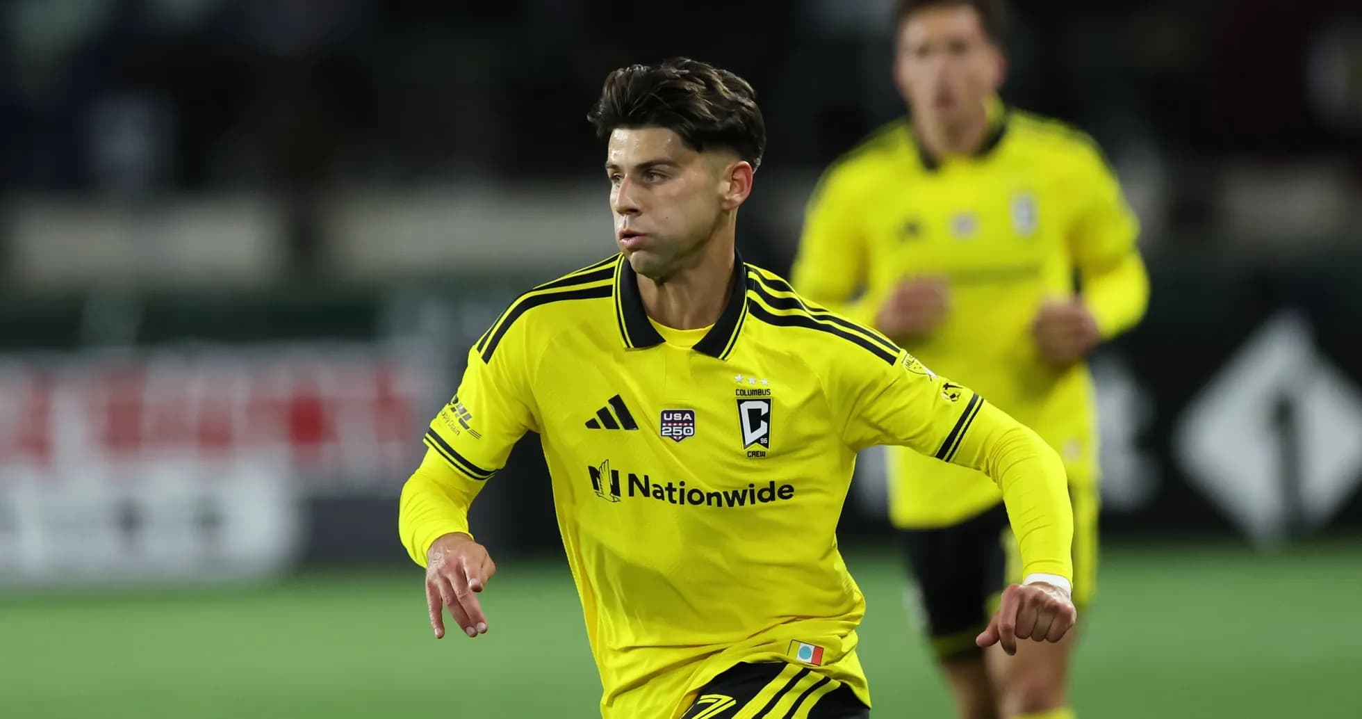 Columbus Crew player in yellow jersey during match Columbus Crew player in yellow jersey during match
