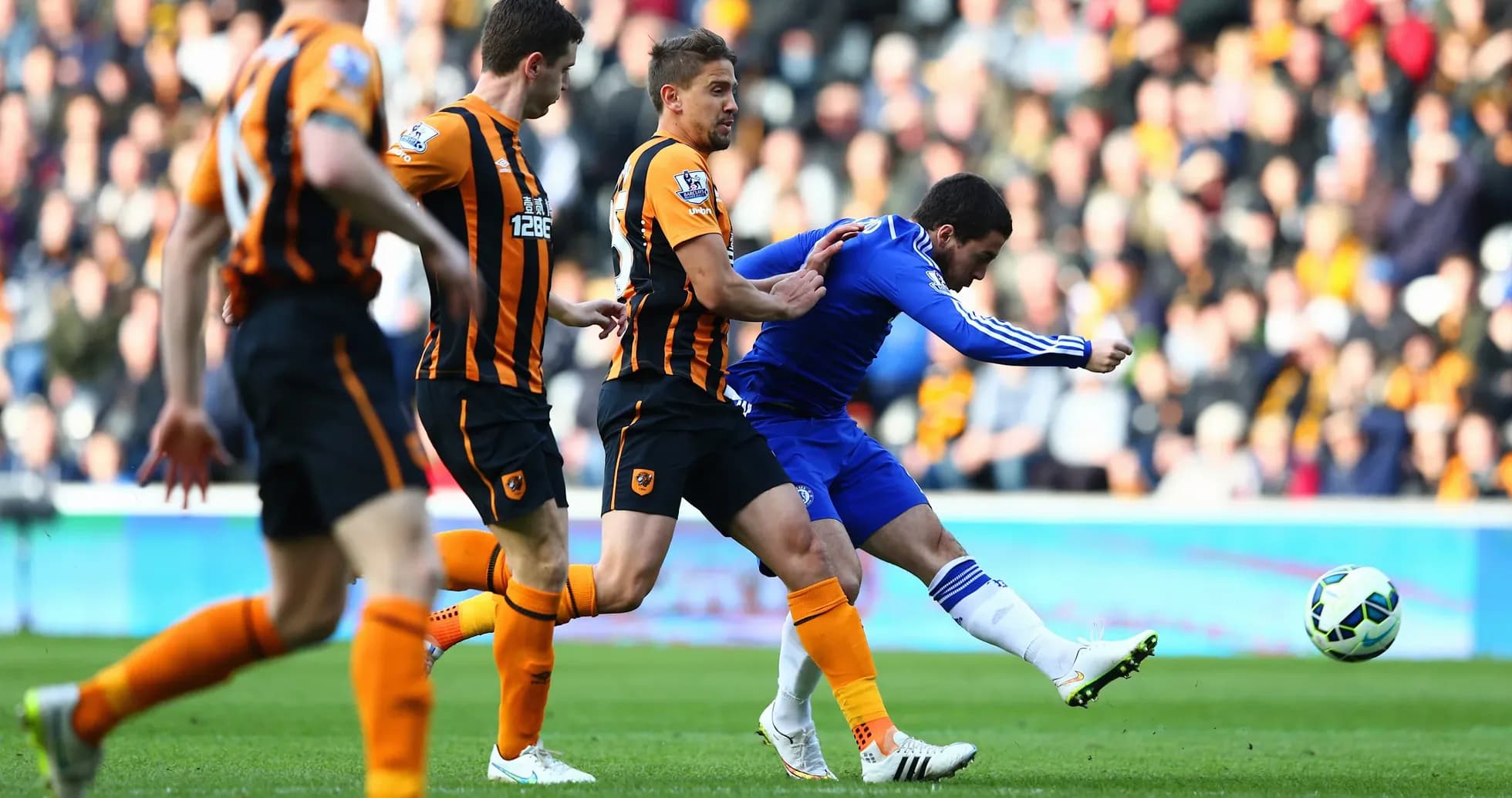 Chelsea player kicking ball against Hull City Chelsea player kicking ball against Hull City