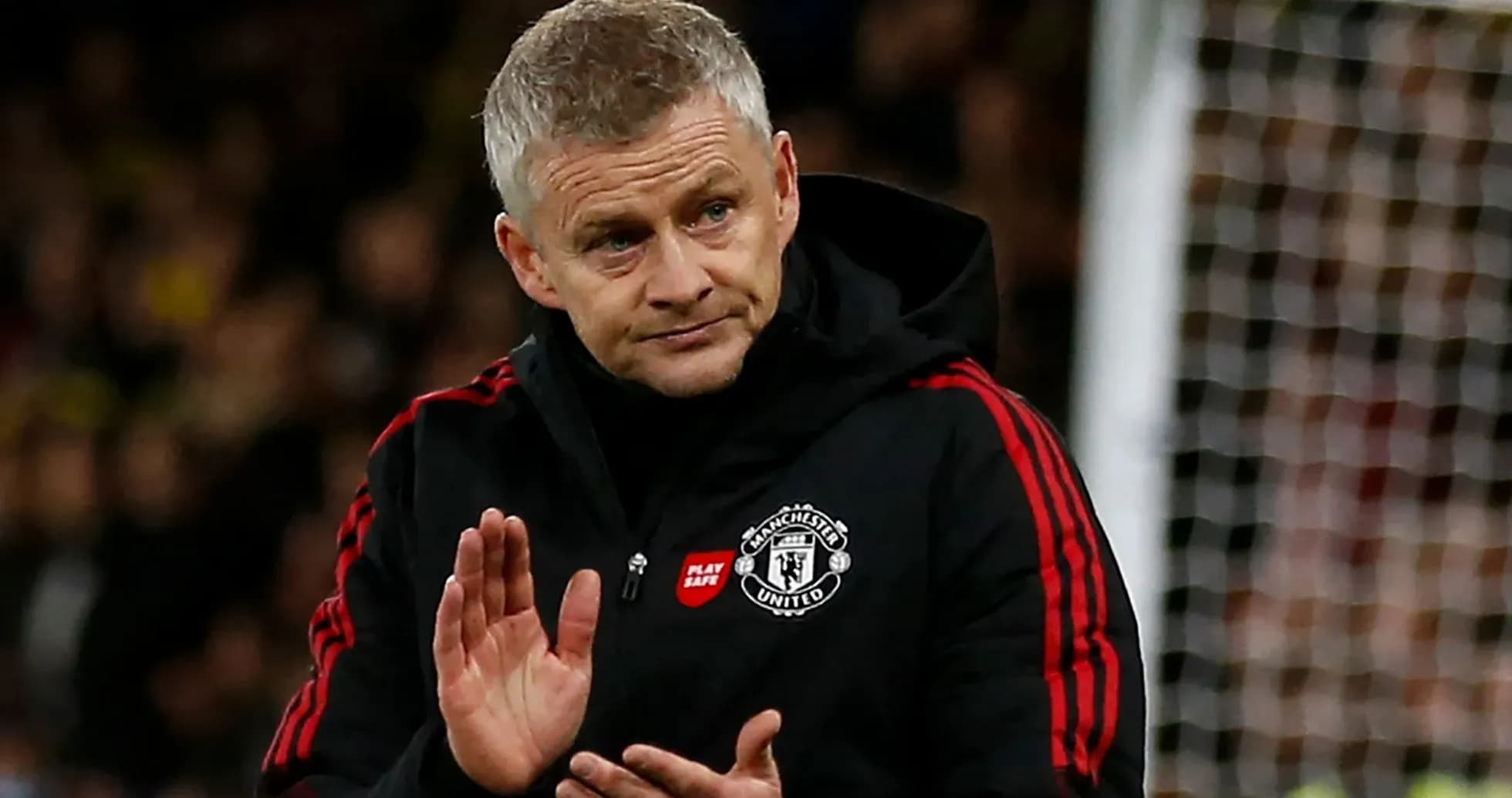 Manager applauding during a match at the stadium Manager applauding during a match at the stadium