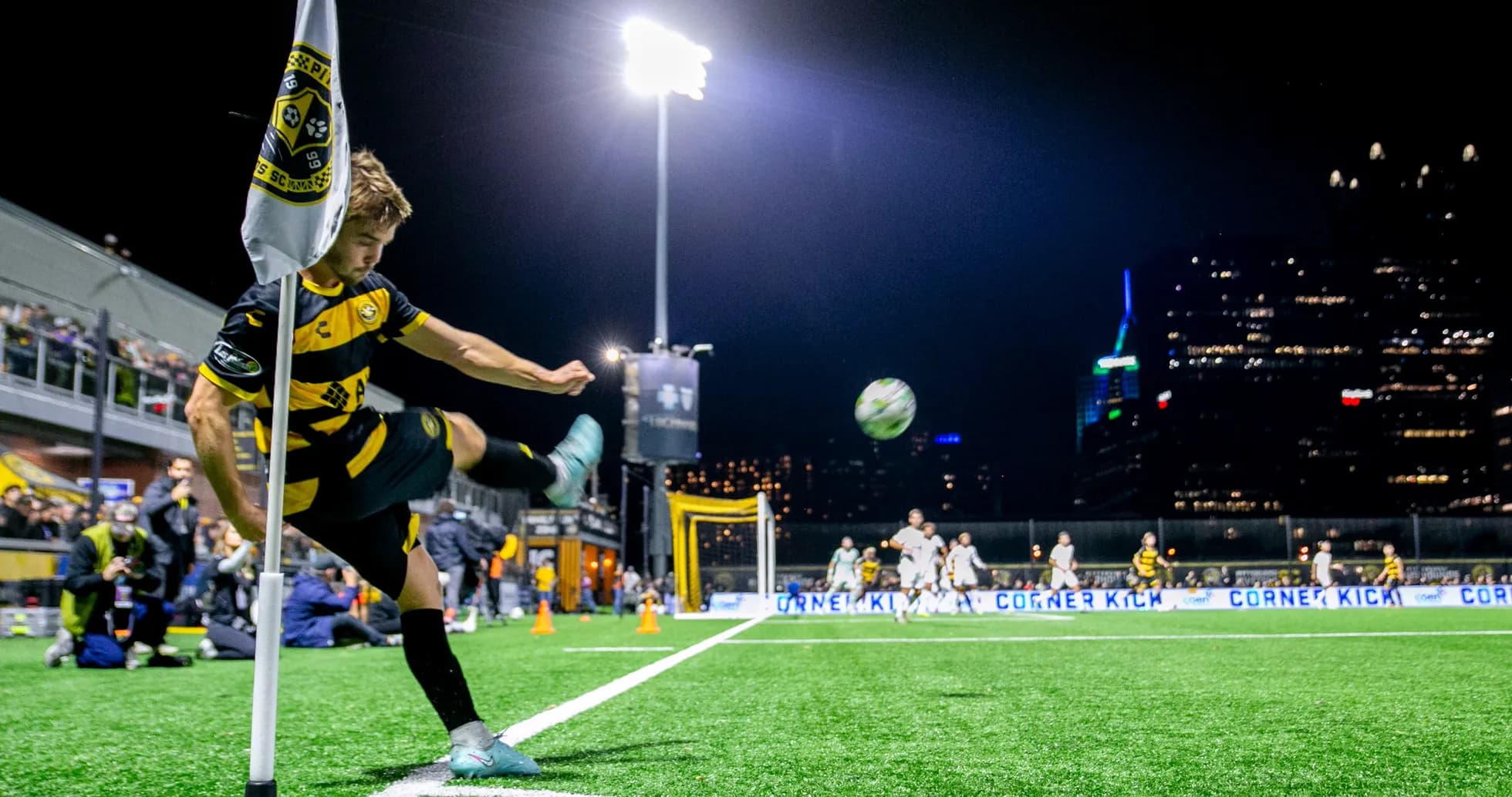 Player taking a corner kick at night Player taking a corner kick at night