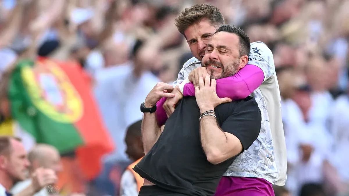 Two coaches celebrating enthusiastically on the sidelines Two coaches celebrating enthusiastically on the sidelines