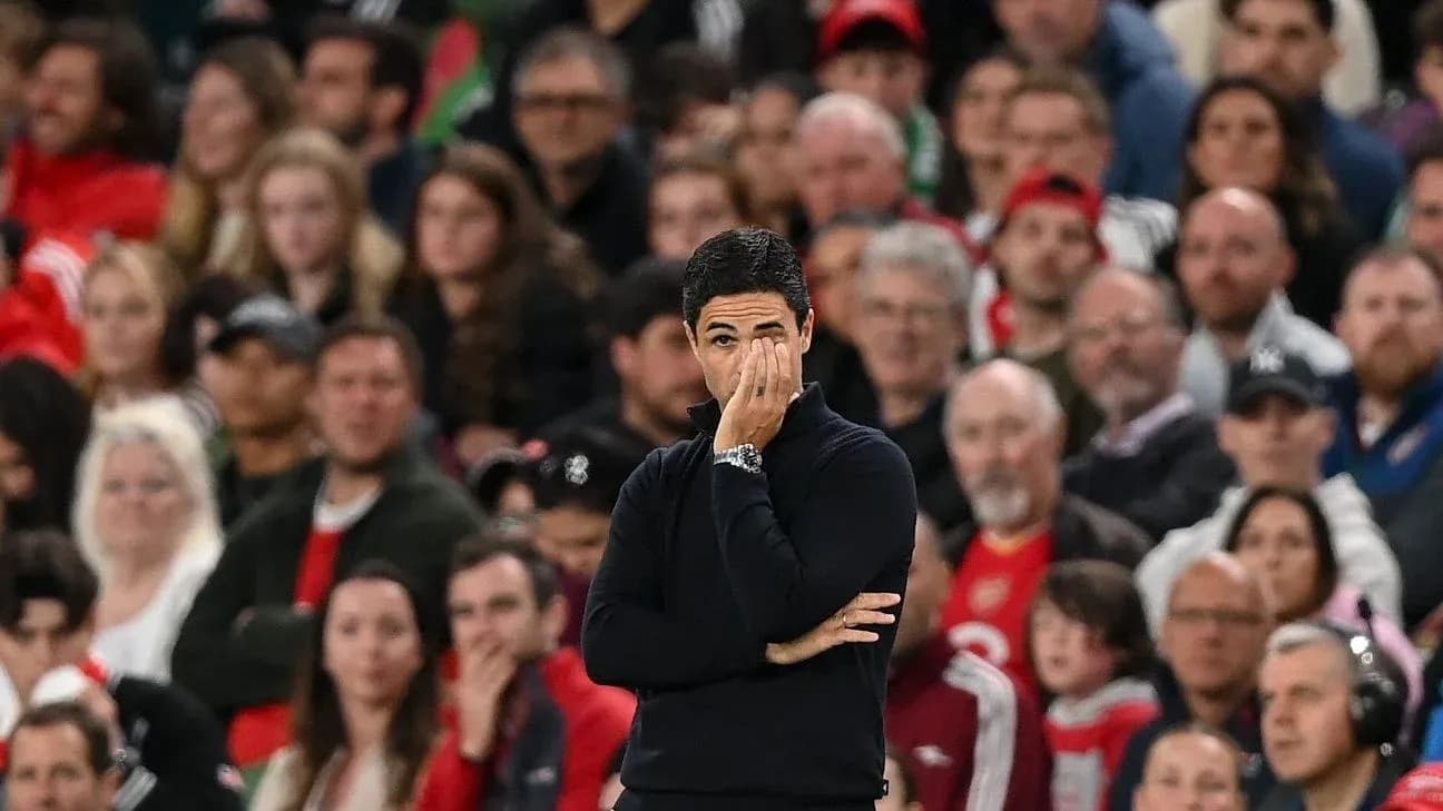 Manager observing match with fans in background Manager observing match with fans in background