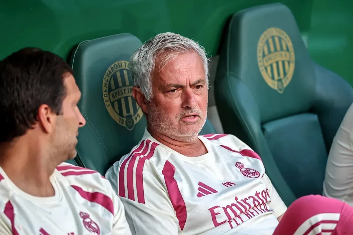 Coach and player sitting on bench during match Coach and player sitting on bench during match